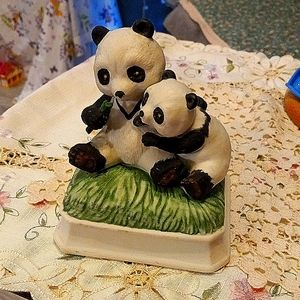 Giant panda mommy and baby music box figurine.